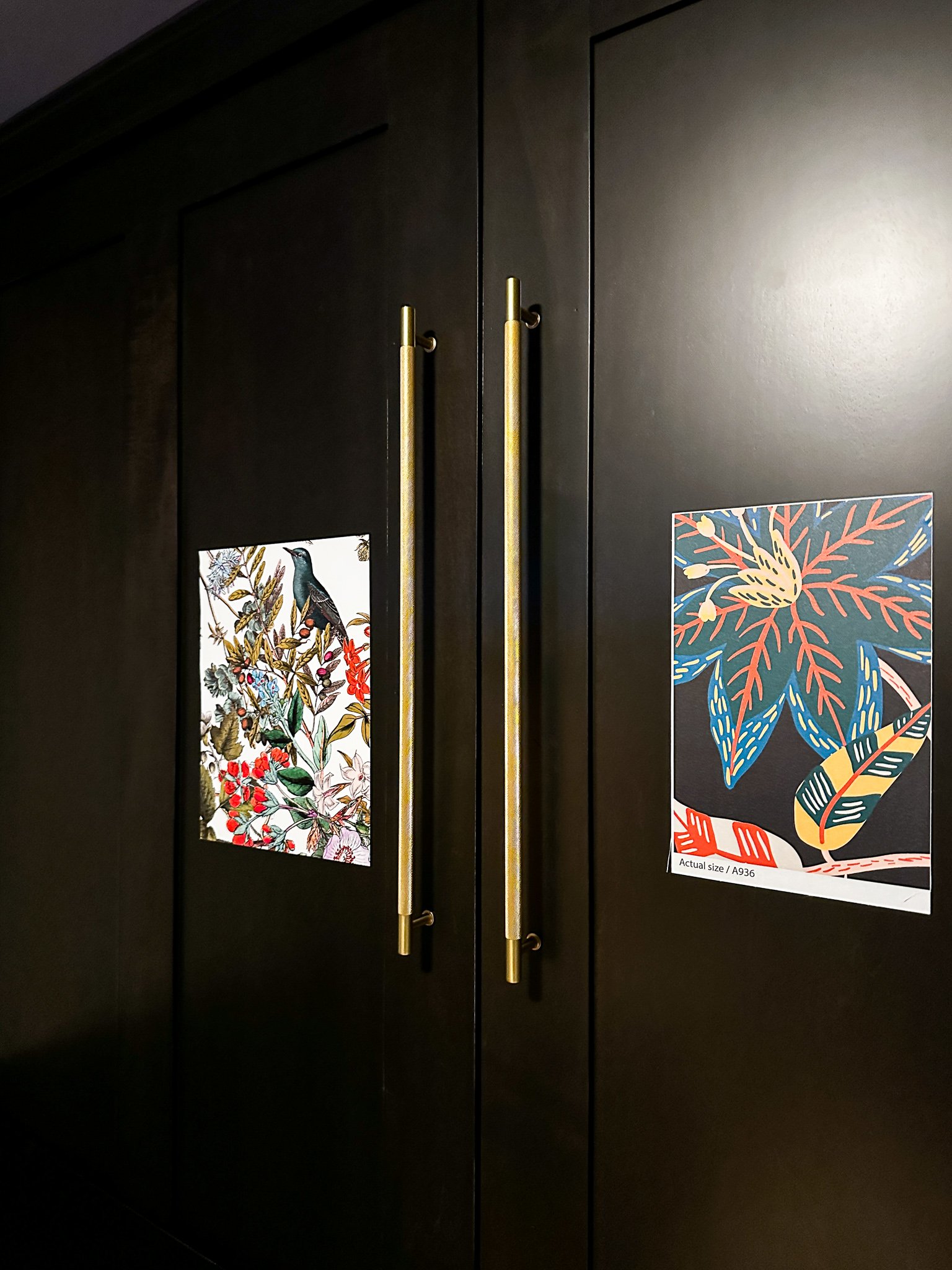 A close-up of knurled brass handles on a Murphy bed.
